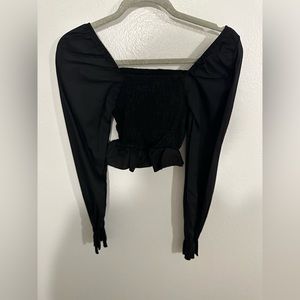 Cropped black long sleeve top